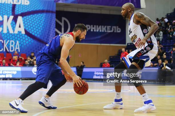 Nikita Kurbanov of the CSKA Moscow shoots the ball against Mickell Gladness of the Kalev Tallinn during the game between CSKA Moscow v BC Kalev/Cramo...