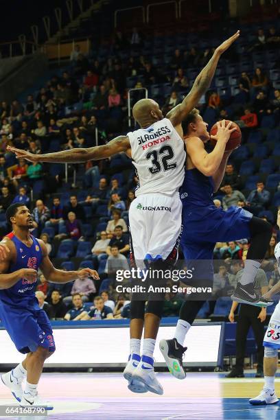 Dmitriy Kulagin of the CSKA Moscow shoots the ball against Mickell Gladness of the Kalev Tallinn during the game between CSKA Moscow v BC Kalev/Cramo...