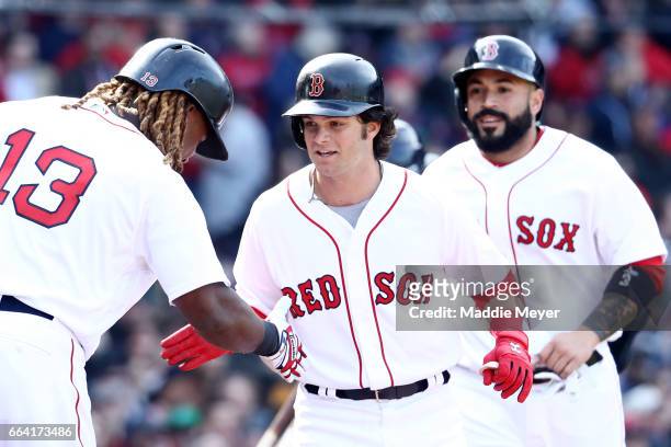 Andrew Benintendi of the Boston Red Sox celebrates with Hanley Ramirez after hitting a three run home run against the Pittsburgh Pirates during the...