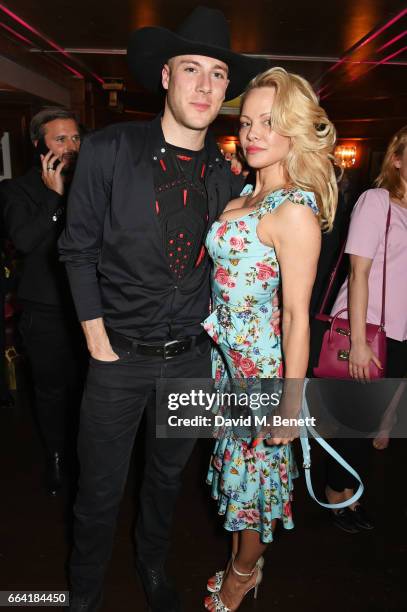 Luke Gilford and Pamela Anderson attend the launch of the Coco De Mer Icons Collection at Albert's Club on April 3, 2017 in London, England.