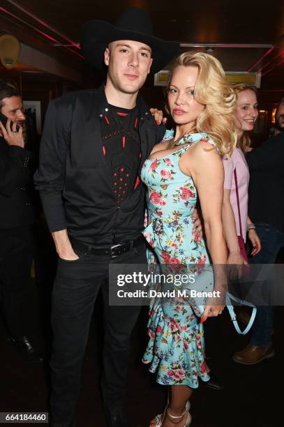 Luke Gilford and Pamela Anderson attend the launch of the Coco De Mer Icons Collection at Albert's Club on April 3, 2017 in London, England.