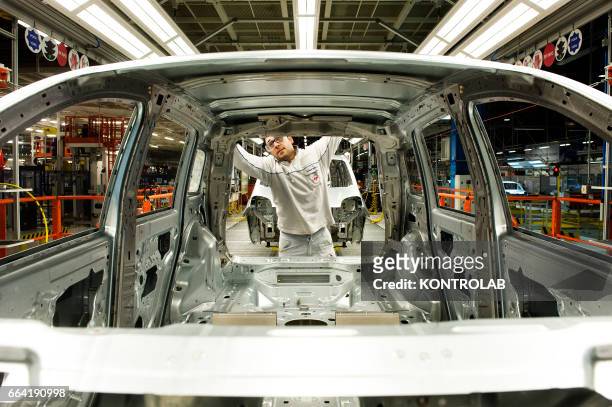 Workers at works in FIAT cars factory "Giovanbattista Vico" in Pomigliano d´Arco, near Naples city, southern Italy.