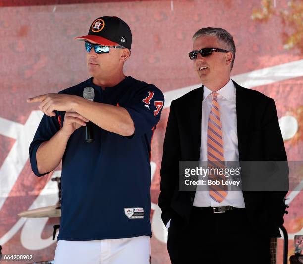Manager A.J. Hinch, left, and Houston Astros general manager Jeff Luhnow talk to fans during a Fan Fest before playing the Seattle Mariners on...