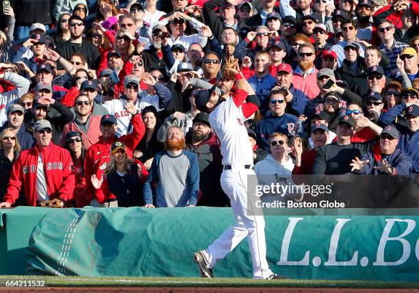 Red Sox Mitch Moreland catches out Pirates' Starling Marte to end the ninth inning. The Boston Red Sox host the Pittsburgh Pirates on Opening Day at...