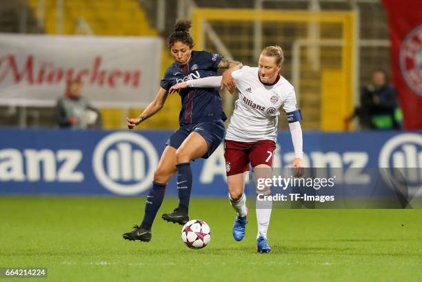 Cristiane of Paris Saint Germain und Melanie Behringer of Bayern Munich battle for the ball during the Champions League match between Bayern Munich...