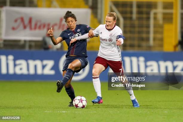 Cristiane of Paris Saint Germain und Melanie Behringer of Bayern Munich battle for the ball during the Champions League match between Bayern Munich...