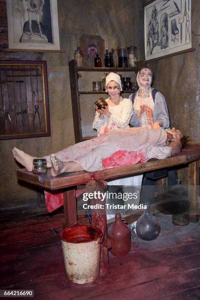 Sarah Tkotsch and protagonist Claudia pose during the VIP Theatre Event At Berlin Dungeon on April 03, 2017 in Berlin, Germany.