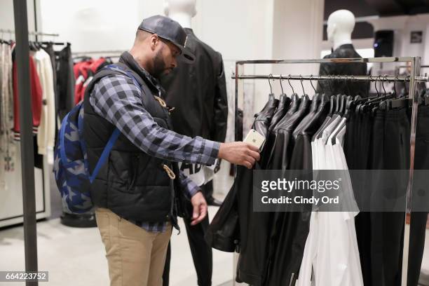 Guest checks out the Dsquared2 x Dwyane Wade Capsule Collection during Saks Fifth Avenue Celebrates the Exclusive Launch of The Dsquared2 x Dwyane...