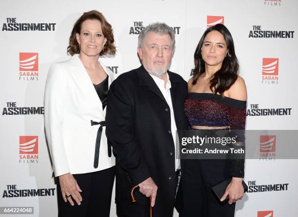 Actors Sigourney Weaver and Michelle Rodriguez pose with Director Walter Hill at "The Assignment" screening at the Whitby Hotel on April 3, 2017 in...
