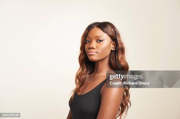 portrait of young woman - black woman long hair stock pictures, royalty-free photos & images