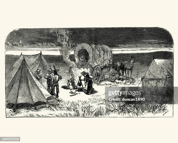 wild west cowboy pioneer camp and wagon - horse cart stock illustrations