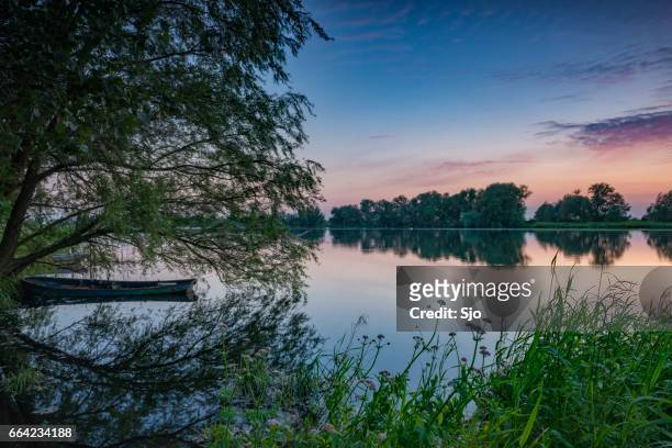 sunset over a lake in nature during spring - overijssel stock pictures, royalty-free photos & images