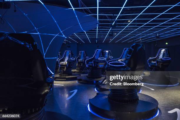 Seats are seen in a 4D cinema that can accommodate 23 people at the SoReal virtual reality park in Beijing, China, on Friday, March 3, 2017. Sky...