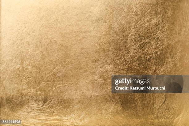 golden textures backgroiund - gold foil stock-fotos und bilder