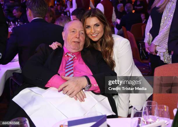 Reiner Calmund and Laura Wontorra attend the German Sports Journalism Award 2017 at Grand Elysee Hotel on April 03, 2017 in Hamburg, Germany.