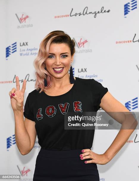 Danni Minogue poses during a press conference announcing Virgin Australia's new Melbourne to Los Angeles flights on April 4, 2017 in Melbourne,...