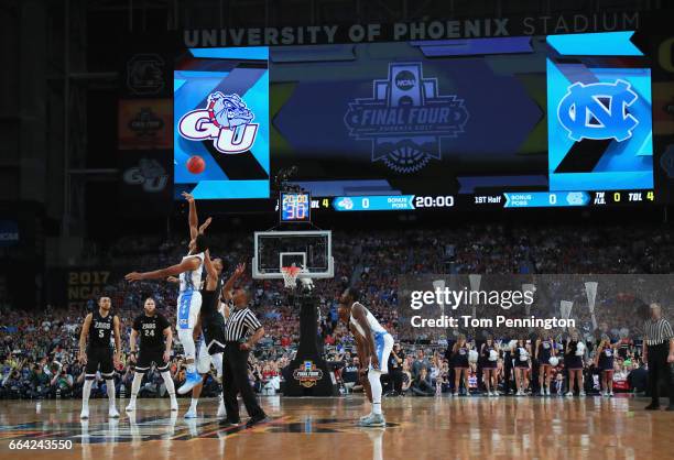 Isaiah Hicks of the North Carolina Tar Heels and Johnathan Williams of the Gonzaga Bulldogs go up for the opening tip during the 2017 NCAA Men's...