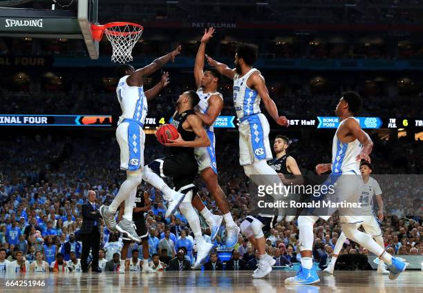 Nigel Williams-Goss of the Gonzaga Bulldogs drives to the basket against Theo Pinson of the North Carolina Tar Heels in the first half during the...