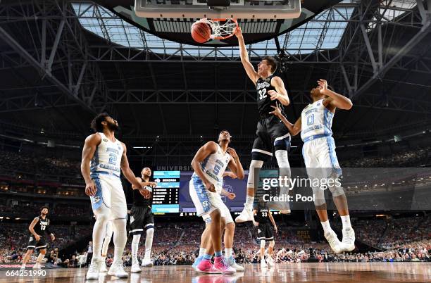 Zach Collins of the Gonzaga Bulldogs dunks in the first half against Nate Britt of the North Carolina Tar Heels during the 2017 NCAA Men's Final Four...