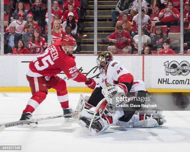 Craig Anderson of the Ottawa Senators makes a save on a shot by Mike Green of the Detroit Red Wings during an NHL game at Joe Louis Arena on April 3,...