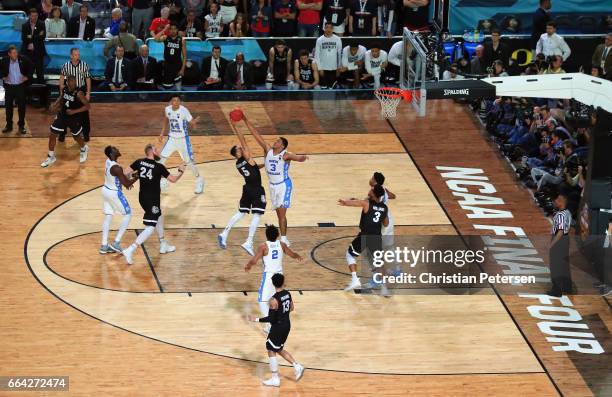 Kennedy Meeks of the North Carolina Tar Heels defends Nigel Williams-Goss of the Gonzaga Bulldogs late in the second half during the 2017 NCAA Men's...