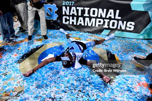 Theo Pinson of the North Carolina Tar Heels makes a confetti angel after time expired during the 2017 NCAA Photos via Getty Images Men's Final Four...