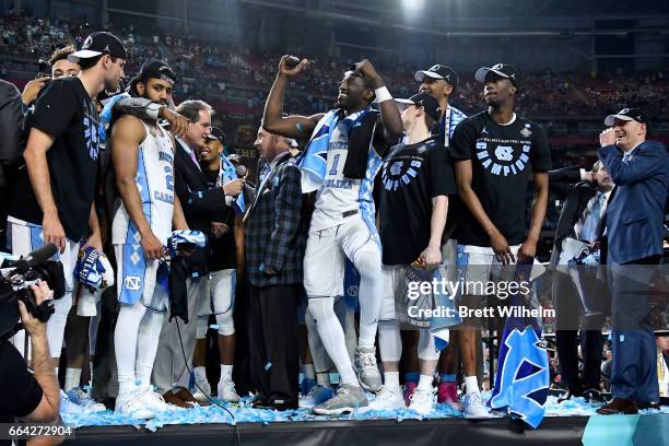 Joel Berry II, Theo Pinson of the North Carolina Tar Heels and team mates celebrate after winning during the 2017 NCAA Photos via Getty Images Men's...