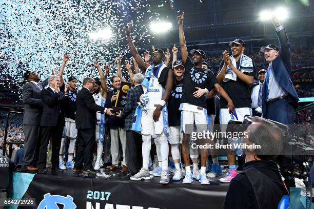 Joel Berry II, Theo Pinson of the North Carolina Tar Heels and team mates celebrate after winning during the 2017 NCAA Photos via Getty Images Men's...