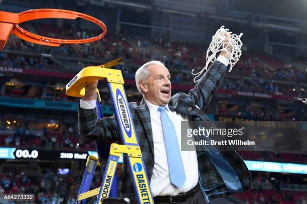 Head coach Roy Williams of the North Carolina Tar Heels cuts the net after winning the championship during the 2017 NCAA Photos via Getty Images...
