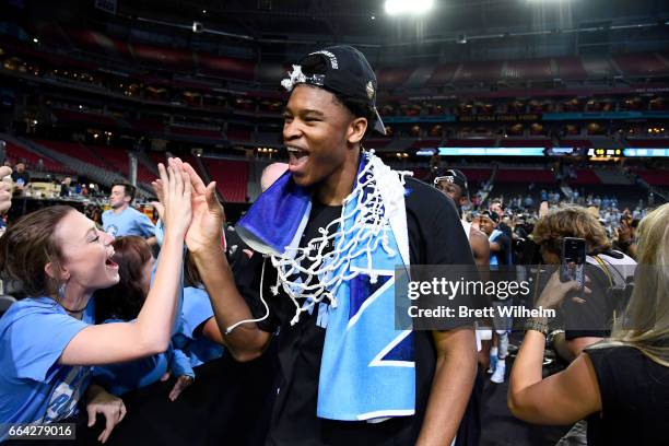 Isaiah Hicks of the North Carolina Tar Heels high-fives fans following the 2017 NCAA Photos via Getty Images Men's Final Four National Championship...