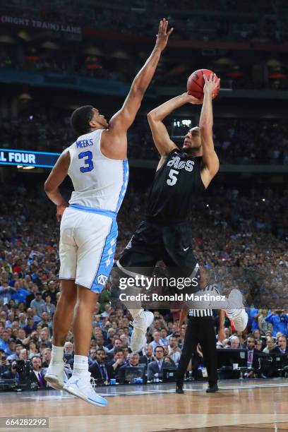 Nigel Williams-Goss of the Gonzaga Bulldogs has his shot blocked by Kennedy Meeks of the North Carolina Tar Heels late in the game during the 2017...