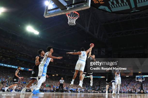 Nigel Williams-Goss of the Gonzaga Bulldogs has his shot blocked by Kennedy Meeks of the North Carolina Tar Heels late in the game during the 2017...