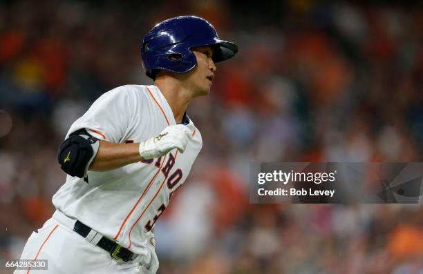 Norichika Aoki of the Houston Astros singles in the third inning against the Seattle Mariners at Minute Maid Park on April 3, 2017 in Houston, Texas.