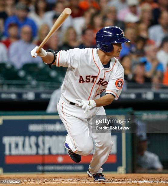 Norichika Aoki of the Houston Astros singles in the third inning against the Seattle Mariners at Minute Maid Park on April 3, 2017 in Houston, Texas.