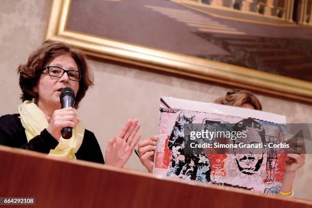 Paola Regeni shows a photo of a mural on a wall in Berlin depicting her son during a press conference relating to the case of the murder of Giulio...