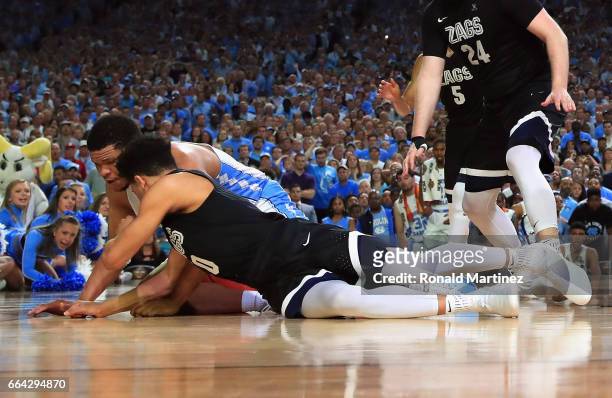 Kennedy Meeks of the North Carolina Tar Heels and Silas Melson of the Gonzaga Bulldogs compete for the ball in the second half during the 2017 NCAA...