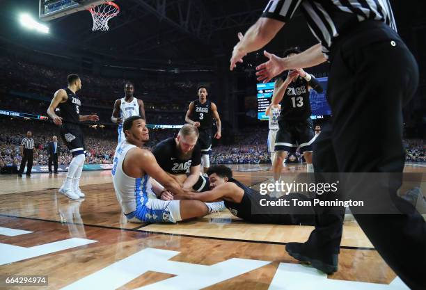 Kennedy Meeks of the North Carolina Tar Heels competes for the ball with Silas Melson and Przemek Karnowski of the Gonzaga Bulldogs in the second...