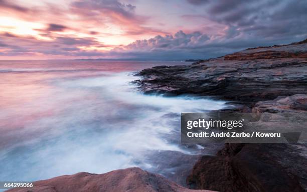 sunset at coast, coastline shirahama, japan on a summer day - felsenküste stock pictures, royalty-free photos & images