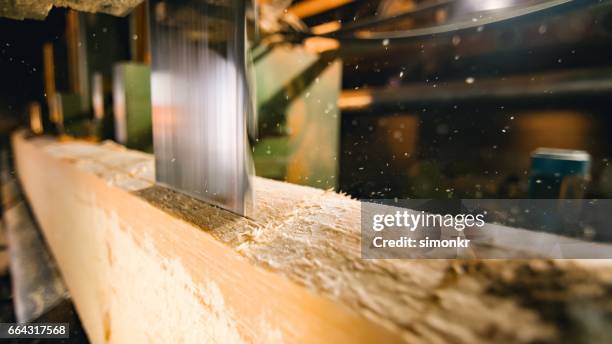 saw cutting a log - logging mill stock pictures, royalty-free photos & images