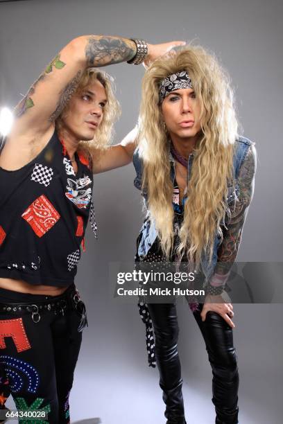 Michael Starr of Steel Panther fixing Lexxi Foxx's hair, studio portrait, Download Festival, 13th June 2010.