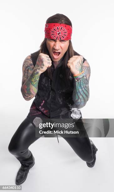 Stix Zadinia of Steel Panther, studio portrait, Download Festival, 16th June 2014.