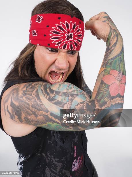 Stix Zadinia of Steel Panther, studio portrait, Download Festival, 16th June 2014.