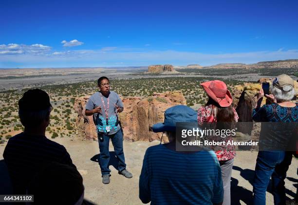 Native American guide talks with visitors at Sky City, one of three villages which make up Acoma Pueblo west of Albuquerque, New Mexico. The village,...