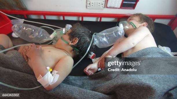 Children get treatment at a hospital after a suspected chlorine gas attack by Assad Regime forces to Khan Shaykhun town of Idlib, Syria on April 4,...