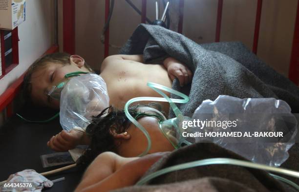 Syrian children receive treatment at a small hospital in the town of Maaret al-Noman following a suspected toxic gas attack in Khan Sheikhun, a...