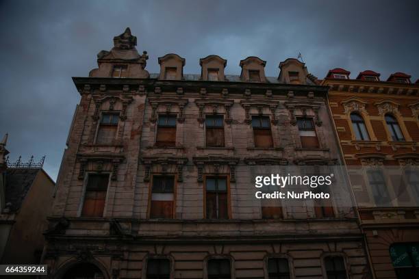 An old building in the center of the city is seen in Bydgoszcz, Poland on 3 April, 2017 with boarded up windows. Even though with the help of...