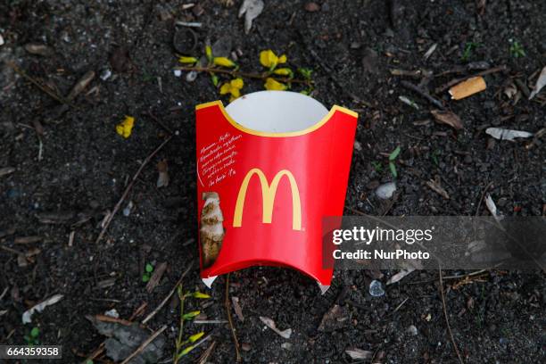 Packaging for McDonalds French fries is seen near a sidewalk in Bydgoszcz, Poland on 3 April, 2017.