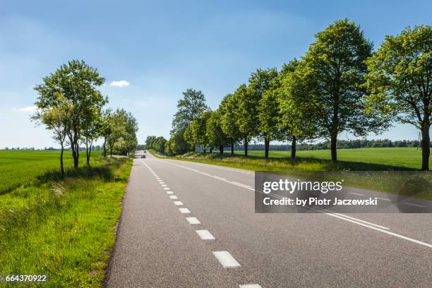 a spring road - highway blue sky car stock-fotos und bilder