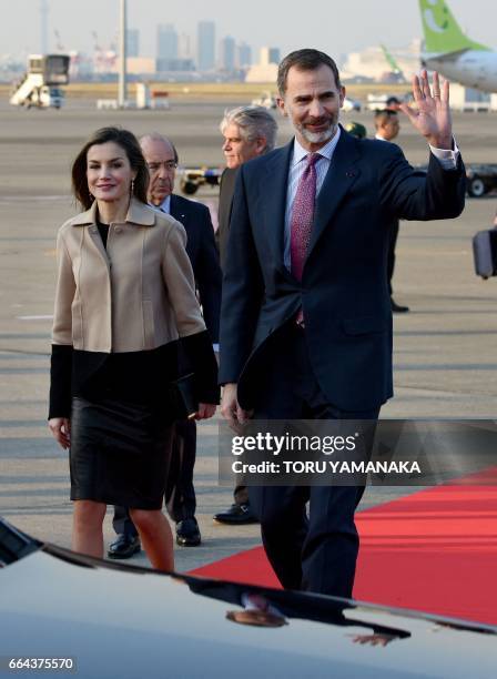 Spanish King Felipe VI and Queen Letizia head for their car upon their arrival at Haneda Airport in Tokyo on April 4, 2017. The Spanish royal couple...