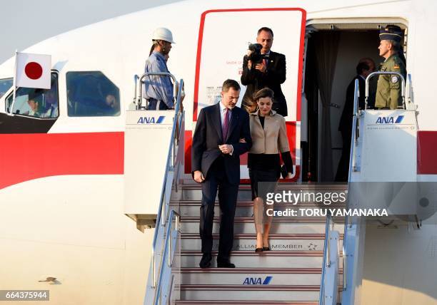 Spanish King Felipe VI and Queen Letizia get off a plane upon their arrival at Haneda Airport in Tokyo on April 4, 2017. The Spanish royal couple is...